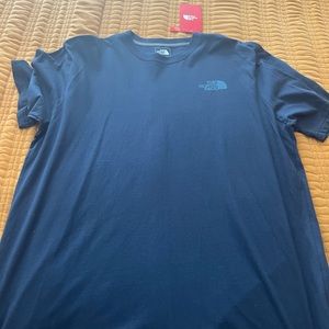Navy blue North Face short sleeve shirt   Never been worn.  With tags